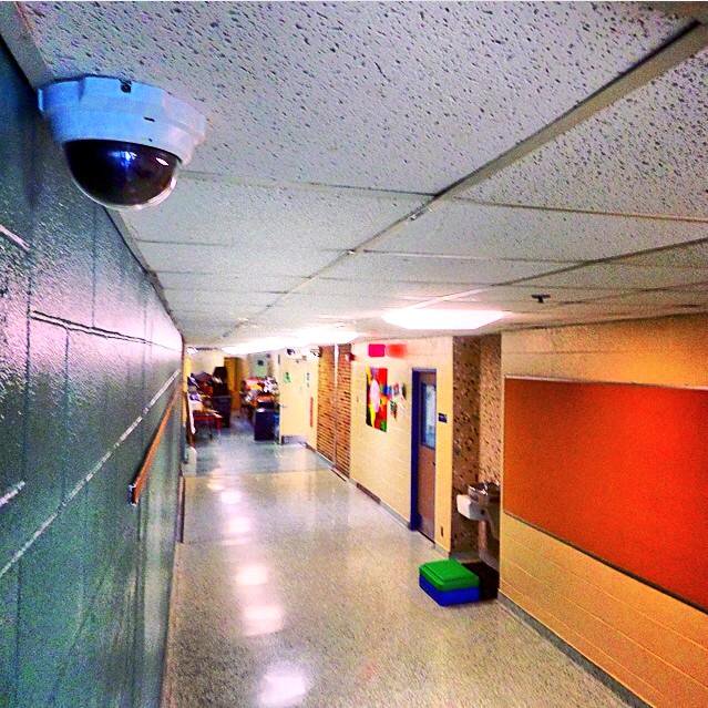 Security camera in school hallway
